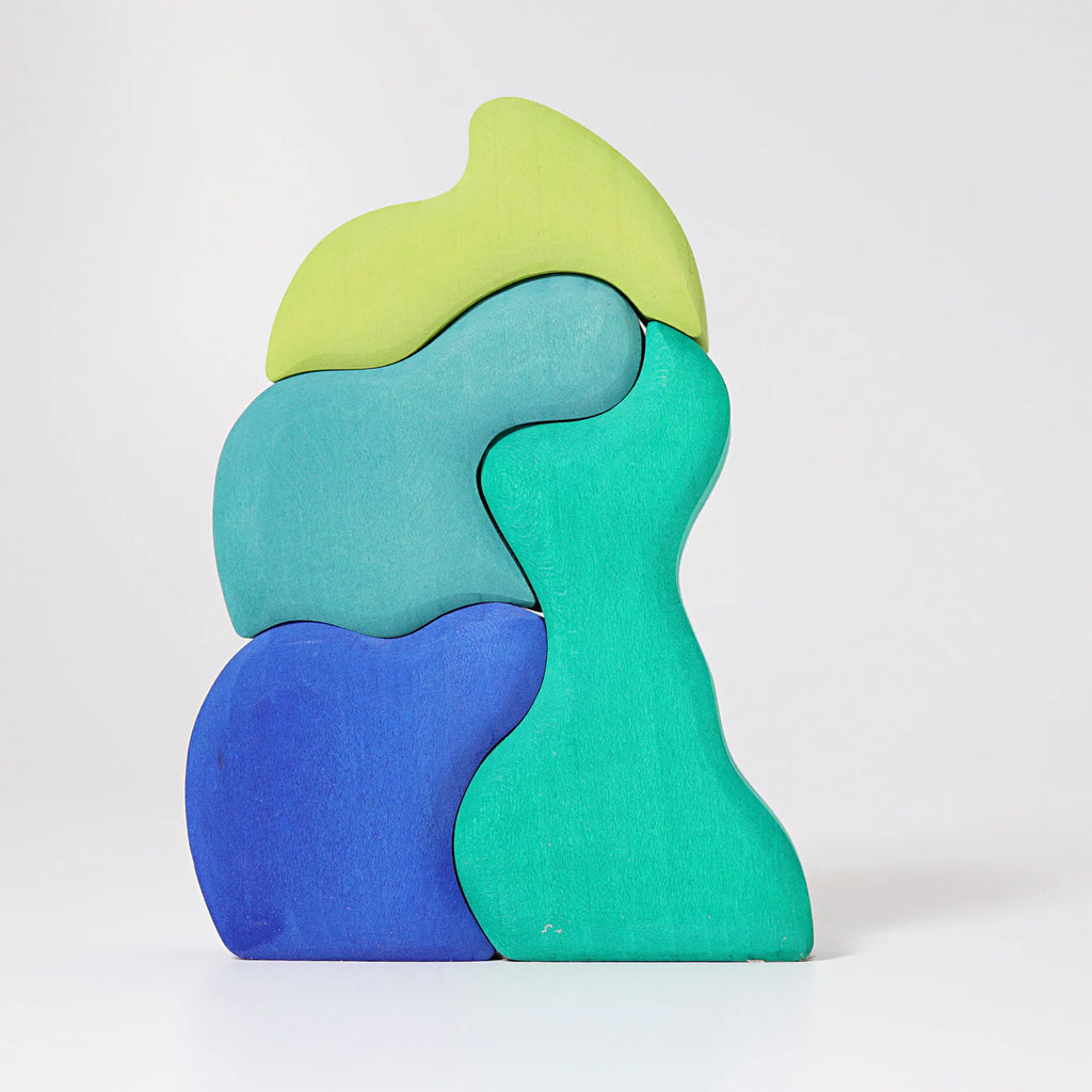 Grimm's Casa Aqua Building Blocks features five irregularly shaped, organically designed blocks in green and blue tones, stacked vertically against a white background—perfect for inspiring imaginative play.