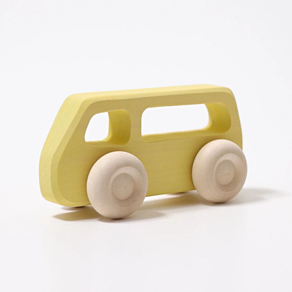 Grimm’s Wooden Cars Slimline, shown here in yellow with cutout windows and natural wood wheels, is finished with natural oils for safety and durability. Set against a plain white background, this classic wooden toy van is perfect for fans of vintage toy cars and makes an ideal toddler toy.