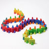 Grimm’s Medium Octagon (ships in 2-3 weeks): Vibrant geometric building blocks arranged in a wavy, snake-like pattern on a white background, each piece featuring square bases and triangle tops in an array of bright colors—together creating a playful and eye-catching triangle toy display.