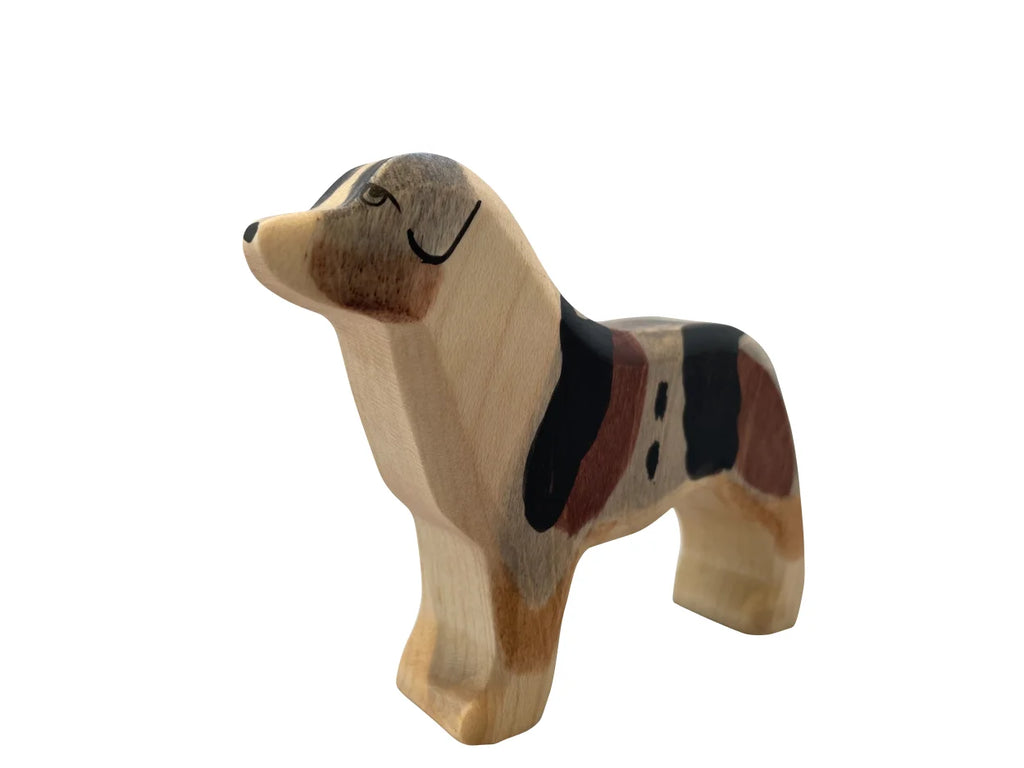A Handmade Holzwald Australian Shepherd figurine painted with realistic colors and details, isolated on a white background from the Holzwald Brand.