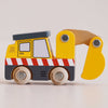 The No. 37 GT210 Eddie | Made in England is a wooden excavator construction toy, showcasing yellow and black accents, red and white stripes, and a movable yellow scoop arm, displayed against a plain light background.