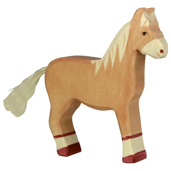 A wooden toy horse painted in light brown with a white mane and tail. The Holztiger Horse, Standing, Light Brown has small red accents on its hooves and a simple, handcrafted appearance. Made in Europe, the tail is crafted from some fibrous material.