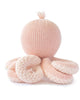 The Cuddle + Kind Baby Octopus (Soft Coral Pink) is a soft, knitted plush toy made from heirloom-quality Peruvian cotton yarn, featuring a round head, small tuft on top, and eight thick, curly tentacles.
