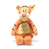 A friendly-looking plush toy tiger from Steiff, inspired by Disney's beloved Tigger, is orange with black stripes and features a light cream belly. It sits upright, sporting large round ears and a pink nose. Attached to its ear is a small tag bearing the Hundred Acre Wood logo. This delightful 12-inch toy captures everyone's adoration.