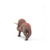 The Schleich Triceratops Dinosaur Toy features textured brown skin with red markings and is shown standing on a white background, facing away from the camera. This educational figurine provides realistic details for imaginative play or display.