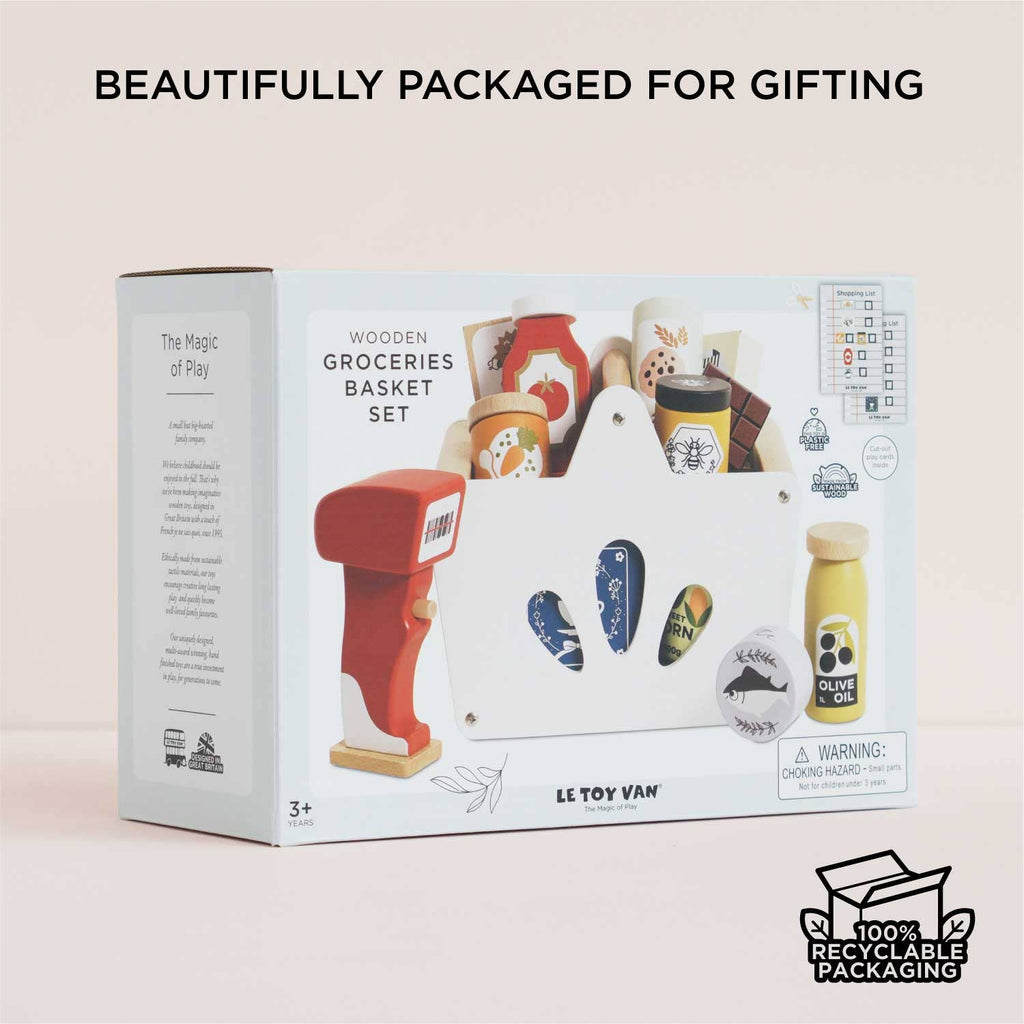 The Groceries Set & Scanner is a wooden grocery playset made from FSC-certified wood, featuring toy food items, a red scanner, and a white basket in 100% recyclable, beautifully gift-ready packaging.