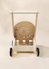 The Wooden Activity Walker features black wheels, a handle, and pastel geometric shape sorter blocks on a neutral background—making it perfect for little ones exploring sensory toys.