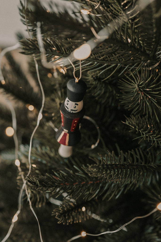 The Sabo Concept Christmas Ornaments include a hand-painted wooden nutcracker soldier, ideal for hanging on your tree with glowing lights and pairing with other nutcracker or ballerina decorations for a festive set.