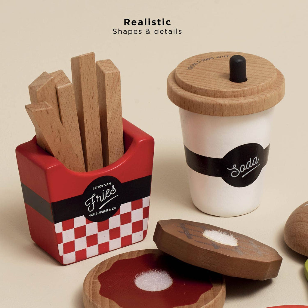 The Gourmet Hamburger Set (ships in one week) features realistic shapes & details: 2 burger buns with condiments, fries in a red container, and a white soda cup—all crafted from sustainable wood, perfect for any play kitchen.