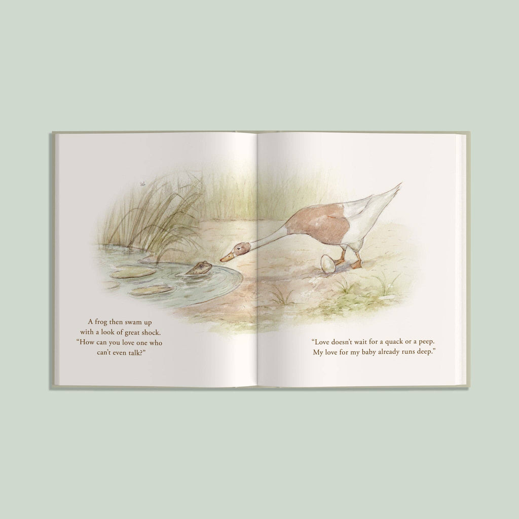 An open copy of “I’ve Loved You from the Start” displays a frog in a pond speaking with a goose on land. The left page features text beside the frog, while the right page shows the goose along with additional words. Soft, pastel illustrations make this picture book a charming choice for parent-child story time or as a thoughtful new baby gift.