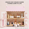 Sophie's Wooden Dolls House features pink accents and an open design revealing furnished rooms and dolls (sold separately). Text above says, "Create cosy spaces where stories come to life." Crafted from FSC-certified wood.