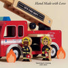 The Wooden Toy Fire Engine & Characters is a charming retro red wooden truck with an extending ladder, two firefighter figures (one with a medical bag), illustrated flames, and "Hand Made with Love" text—crafted sustainably.