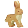 A handcrafted Holztiger Rabbit, Standing of a brown rabbit with white accents on its belly and chest. Crafted out of maple and beech wood, the rabbit is depicted in a sitting posture with its long ears pointed upwards. The figurine features simple, painted details and has a smooth finish.