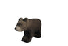 A small wooden Handmade Holzwald Small Bear - Walking figurine in a walking pose.