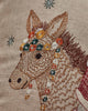 Intricate embroidery of a donkey's head on beige fabric with colorful flowers and star-like accents—perfect as festive holiday decor or a charming touch to a Christmas toy basket. Introducing the Christmas Donkey Pillow!.