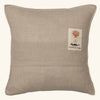 The Coral & Tusk Aspen Skiers Pillow is a square beige pillow with detailed embroidery, ideal for adding cozy winter decor to your space.