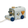 The Sorting Bus - Orchard Series is a wooden pull toy inspired by the classic bus design, featuring blue wheels, a peg driver, and shape sorter holes on its side. It includes a yellow triangle block that fits into one of the holes, and comes with a string at the front for pulling.