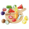 The Wooden Chopping Board & Sliceable Play Food set features a colorful selection of fruits and vegetables such as carrot, watermelon slices, lemon, cucumber, kiwi, fig, strawberry, and eggplant. This charming role play kit comes with a wooden knife and peeler designed to help young chefs enhance their motor skills.