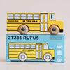 A retro wooden school bus painted in vibrant yellow with “LE TOY VAN” branding sits atop a blue box labeled “No. 47 GT285 Rufus | Made in England.” The box features an illustration matching the toy bus, capturing classic American charm and inviting imaginative journeys. Text on the packaging indicates it is a limited edition, perfect for ages 2 and up.