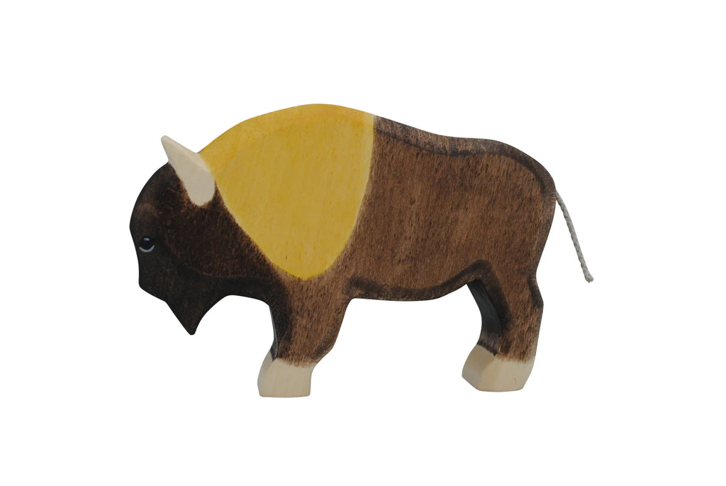 The Handmade Holzwald Bison is a sustainable wooden toy featuring hand-painted brown, yellow, and black details, standing on four legs against a plain white background.