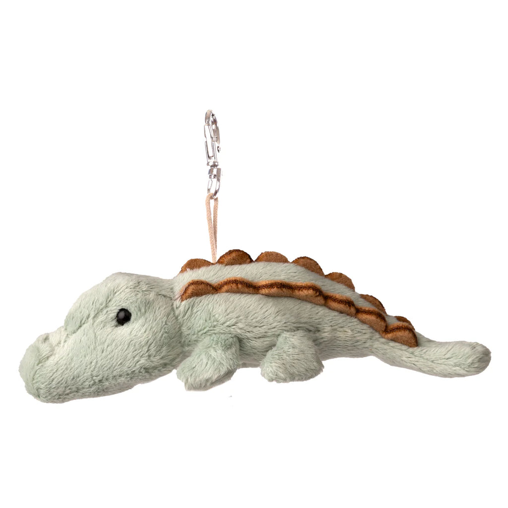 Introducing the Bukowski - Maximus Alligator Bag Charm: a light green plush alligator keychain featuring brown ridges along its back, lying flat with a small chain attached to the top—perfect as a playful backpack accessory or a fun addition to your keyring.