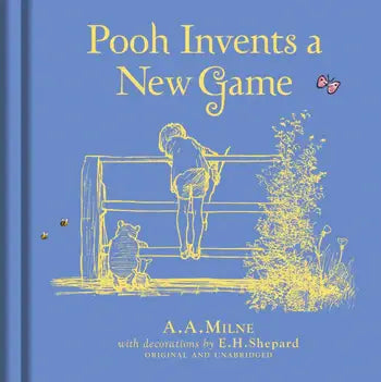 The cover of Winnie-the-Pooh: Pooh Invents a New Game shows Pooh and Christopher Robin by a fence, with yellow line art and butterflies on a blue background—perfect for children’s stories.