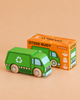 A green wooden recycling truck with sturdy wooden wheels sits next to its bright orange box labeled “No. 36 GT200 Rudy | Made in England.” This eco-friendly toy displays a bold white recycling symbol and red-striped accents on the side, making it ideal for sustainable play.