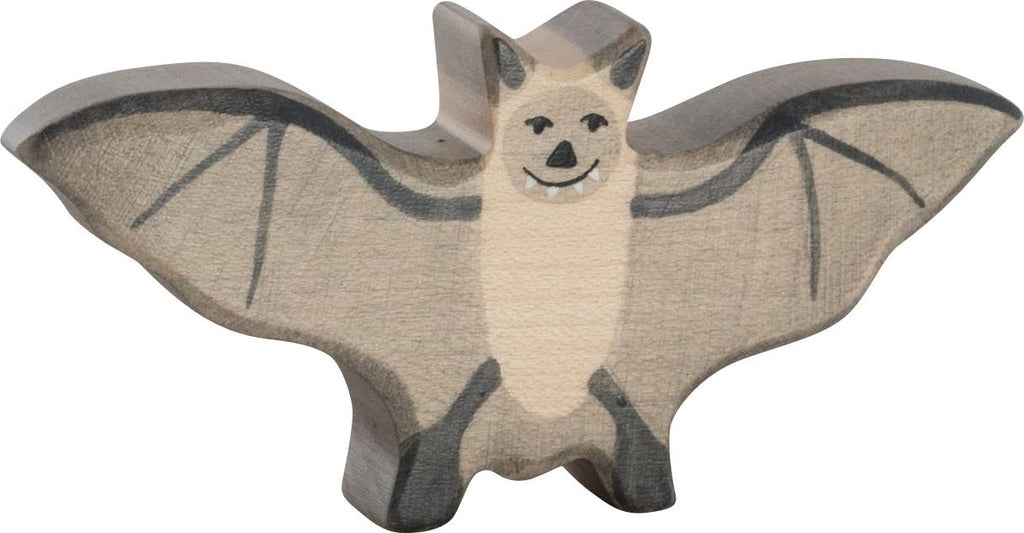 The Holztiger Bat is a handcrafted wooden toy with outstretched wings, painted in neutral tones with a smiling face and simple black details. Made in Europe, it features the quality materials and craftsmanship HOLZTIGER is known for.
