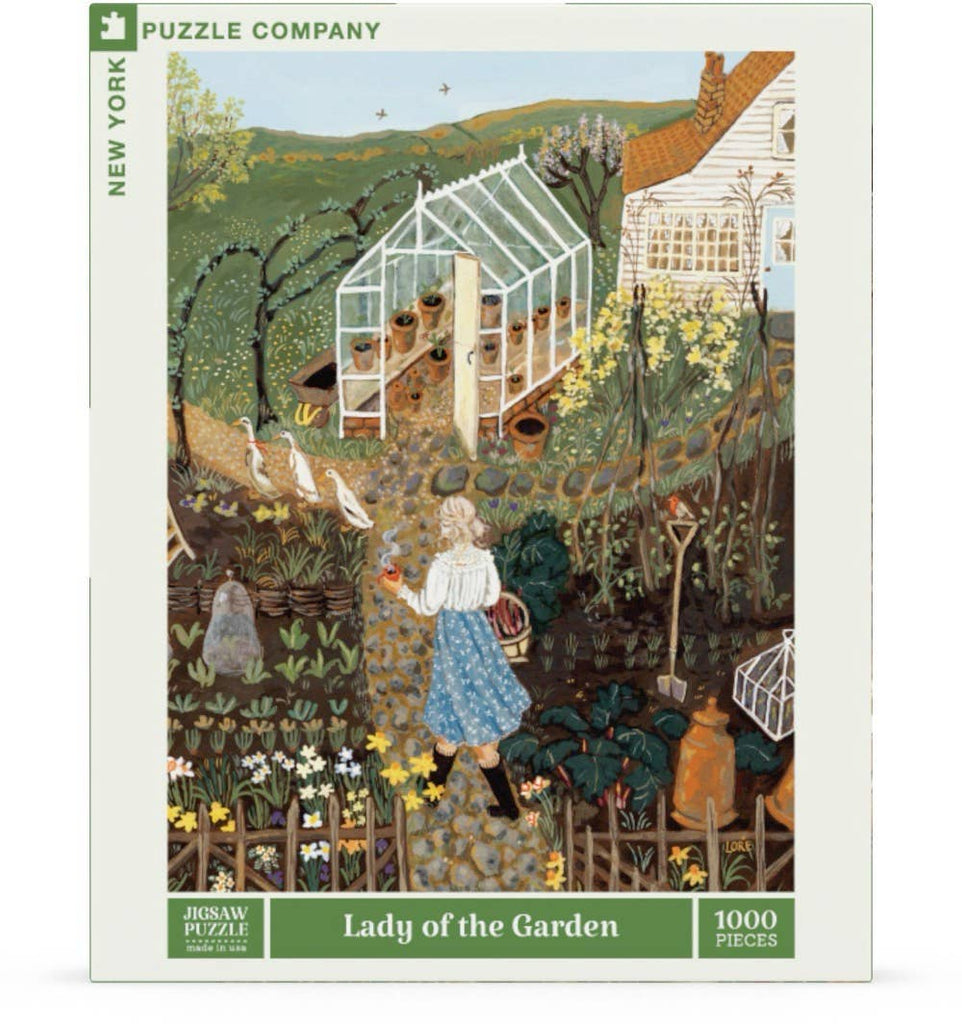 Lady of the Garden - 750 Piece Spring Jigsaw Puzzle box featuring an illustration of a woman walking through a garden toward a greenhouse, accompanied by three white ducks.