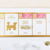 A gold-colored metal thimble token rests on Illinois Avenue on the Monopoly Bianco Edition game board, which also features the B. & O. Railroad and Indiana Avenue spaces.