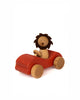 The Sabo Concept Car with Lion features a wooden lion with a dark brown mane riding in a small red car—ideal for imaginative play with its smooth, natural wood design.