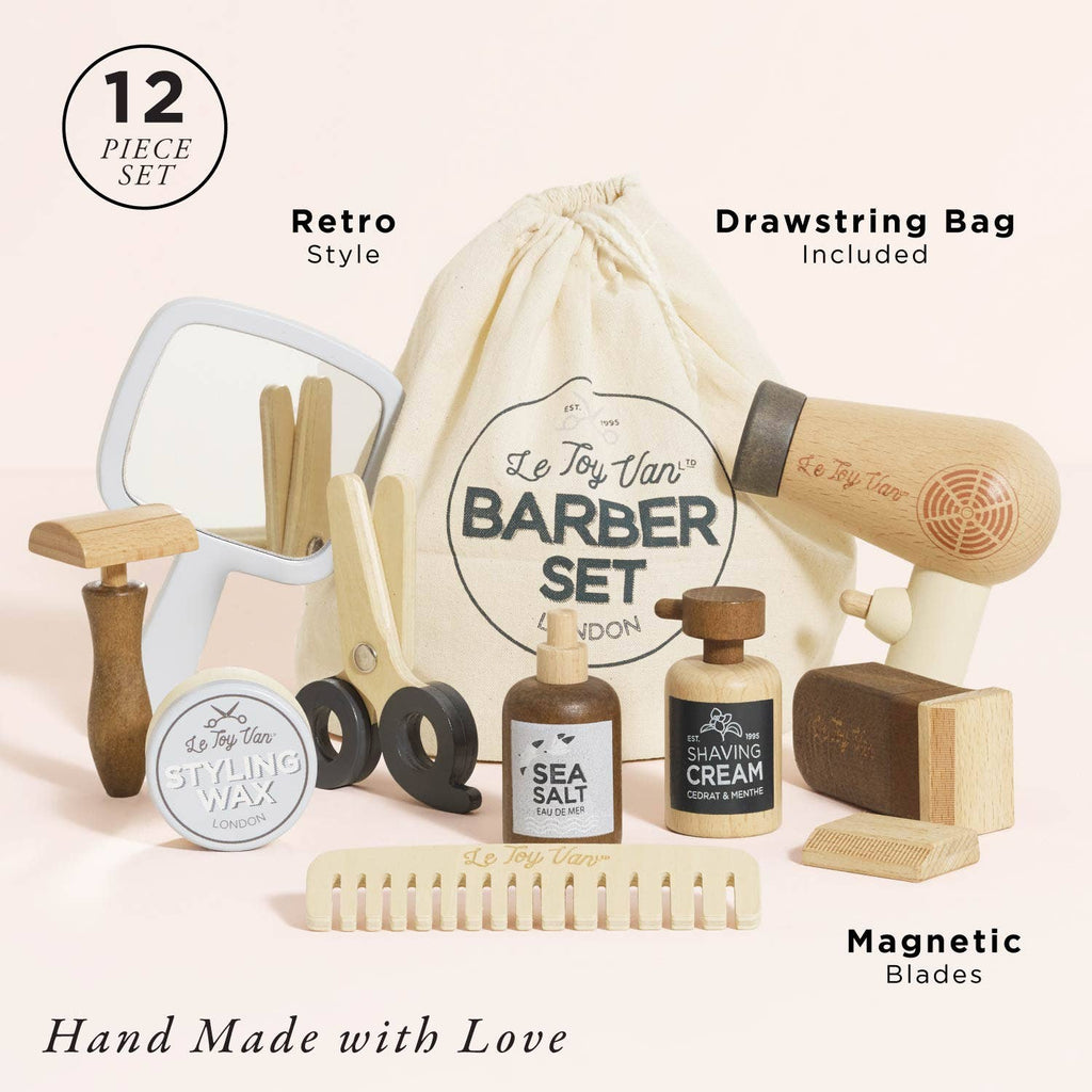 The Wooden Hairdresser & Barber Kit (ships in one week) is a 12-piece plastic-free set featuring a mirror, scissors, razor, hairdryer, styling wax, sea salt bottle, shaving cream, comb & drawstring bag. Hand Made with Love—perfect for little stylists!.