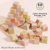 ABC Learning Blocks feature colorful wooden letters and images, stacked in a pyramid on a wooden storage tray. Includes 30 blocks, letter matching tray, and is hand made with love. Ships in one week—perfect for toddler learning.