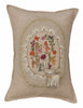 The Sugar Egg Pocket Pillow is beige and features colorful embroidered animals, flowers, and mushrooms in an oval frame. A small fabric lamb is attached at the bottom, enhancing its whimsical Easter wonderland design.