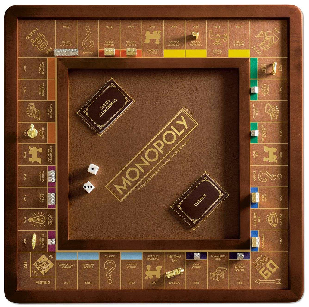 The Monopoly Luxury Edition is a premium board game with gold-colored details, a wooden frame, die-cast metal pieces, cards, dice, and property spaces arranged around a brown square center labeled "Monopoly.