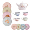 The Moulin Roty Tea Party Suitcase - The Rosalies is a pastel children’s tea set featuring plates, cups, and a teapot decorated with fox, hedgehog, rabbit, owl, and delightful woodland scenes.