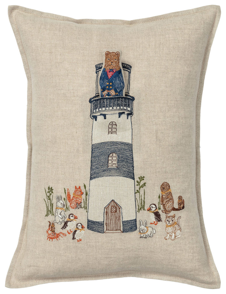 Introducing the Coral & Tusk Lighthouse Friends Pocket Pillow, a charming decorative pillow made from 100% linen. This delightful piece features an embroidered design of a lighthouse with a Lighthouse Keeper Bear standing at the top. Surrounding the lighthouse are various embroidered animals, including rabbits, squirrels, a fox, and a snail, creating an enchanting nautical scene against the neutral fabric background.