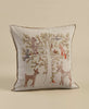 The Coral & Tusk Woodland Living Tree Pillow is a square beige cushion embroidered with a family tree and forest animals—bear, raccoon, fox, owl, and deer—arranged on the branches. Ships in one week.