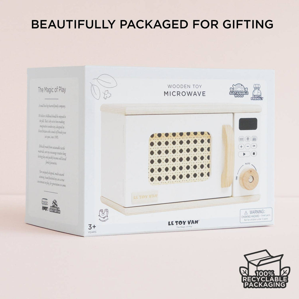 A white box featuring the Wooden Microwave by Le Toy Van, crafted from sustainable wood. The packaging uses simple illustrations and text, perfect for play kitchens and comes in beautiful, recyclable gift-ready packaging. Ships in one week.