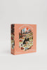 The Secrets of the Autumn Woods 300 Piece Puzzle comes in a peach-colored box featuring playful autumn forest artwork with people outdoors and includes a large illustrated reference poster.