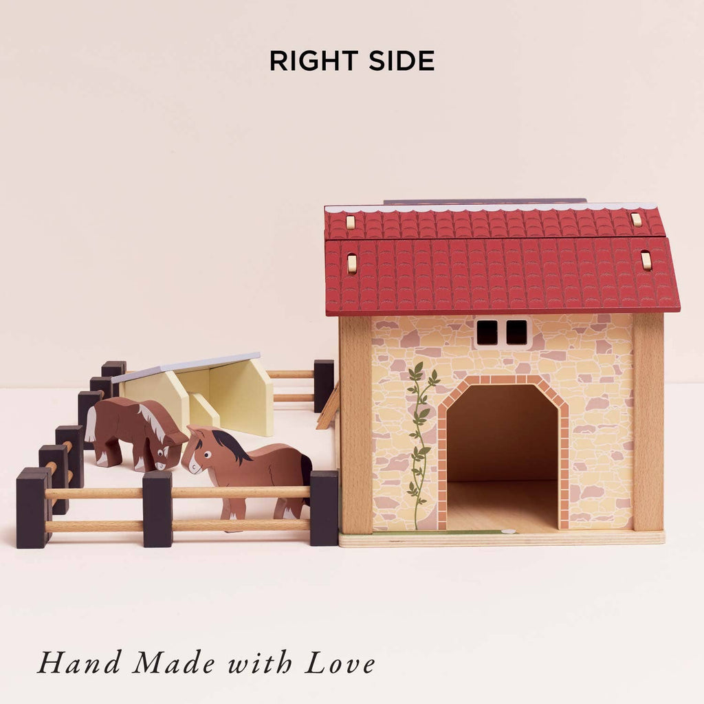 The Wooden Farmyard Stables set features a red-roofed building with stone-like walls, a fenced play area, two toy horses, and shelters. Text reads "RIGHT SIDE" at the top and "Hand Made with Love" at the bottom.