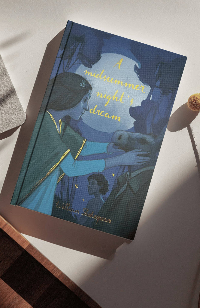 A blue hardcover Collector’s Edition titled “A Midsummer Night’s Dream | Shakespeare Collector’s Edition,” featuring an illustrated cover of a woman touching a man in a donkey mask, with a child in the background.