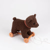 Pull-Along Raoul, a lovable Egmont Toys plush toy, is a brown pull-along bear with wooden wheels and a convenient pull string, shown against a plain white background.