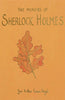 The cover of "The Memoirs of Sherlock Holmes | Collector's Ed. | Hardcover" by Arthur Conan Doyle features an illustration of an orange and red oak leaf on a vivid yellow-orange backdrop.