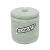 A light green, handcrafted Basket Cookie Jar with a natural cork lid, labeled "cookies" on a black and white tag.