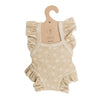 Mrs. Ertha Doll Clothes - 13″-14″ Little Daisys Frilled Bodysuit: A beige romper adorned with white daisy patterns and ruffled sleeves, displayed on a brown hanger. This handmade, 100% cotton bodysuit is perfectly sized for Minikane dolls.