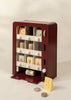 The Wooden Play Vending Machine encourages pretend play with knobs, compartments, and food-themed blocks like cheese and fruit. Ideal for developing motor skills, this toy features a neutral design to fit any playroom.