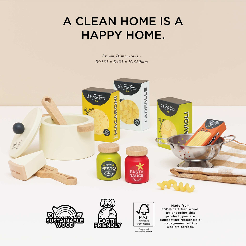 The Pretend Play Pasta Set features toy kitchen items like boxed pasta, sauce jars, a colander, wooden spatula, and cheese grater. The phrase "A CLEAN HOME IS A HAPPY HOME" highlights imaginative play with eco-friendly logos supporting sustainability.