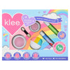 Klee Naturals Makeup Kit - After the Rain- Rainbow Dream featuring two round powder containers, a dual-ended applicator, a blush brush, strawberry lip shimmer, and roll-on fragrance against a rainbow and heart-themed background.
