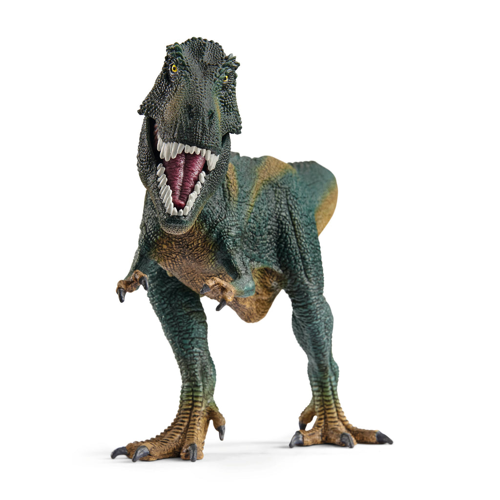 A Schleich Tyrannosaurus Rex Dinosaur Toy with Movable Jaw, featuring green and brown coloring, stands on two legs with its mouth open to reveal sharp teeth against a white background.